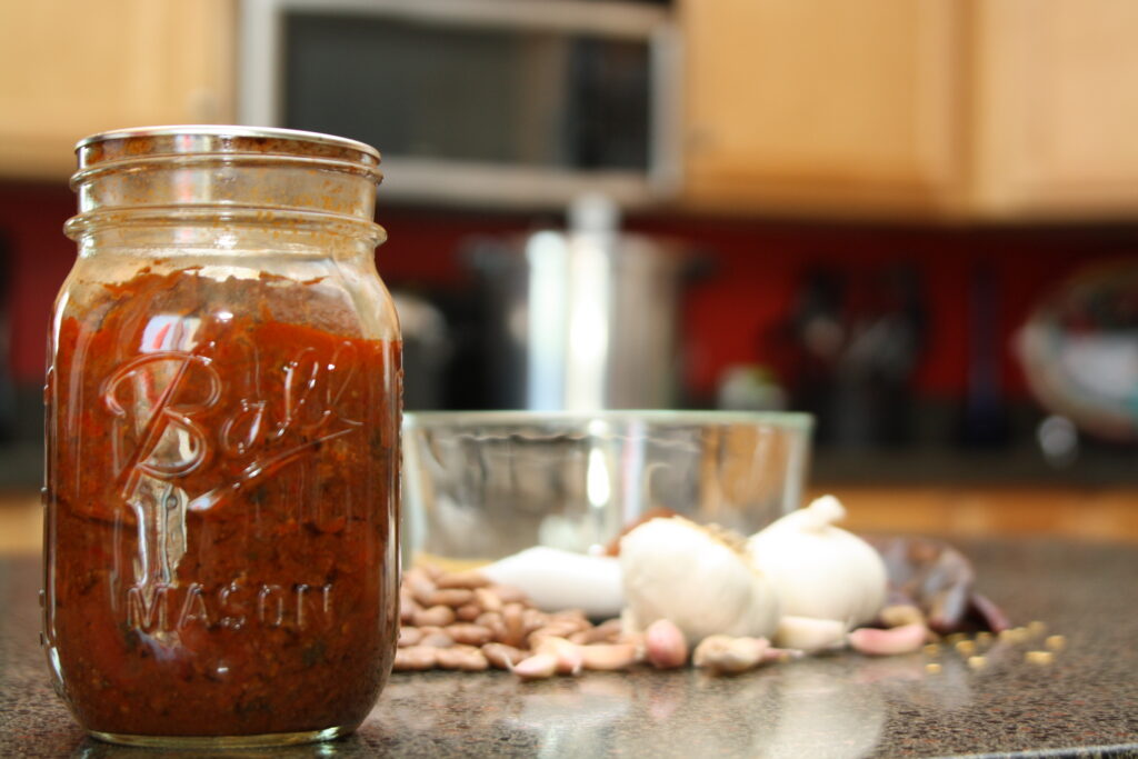 chili made with meat and beans in a jar for pressure canning recipe