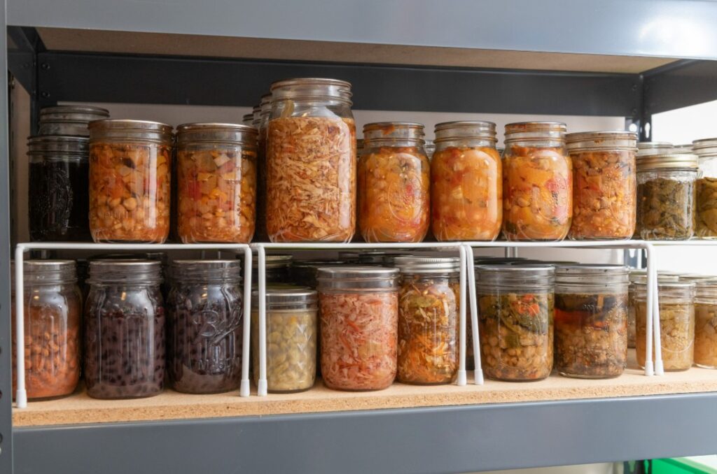 home canned goods stacked in pantry the canning diva