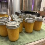 Mango jam out of the canner after processing wide