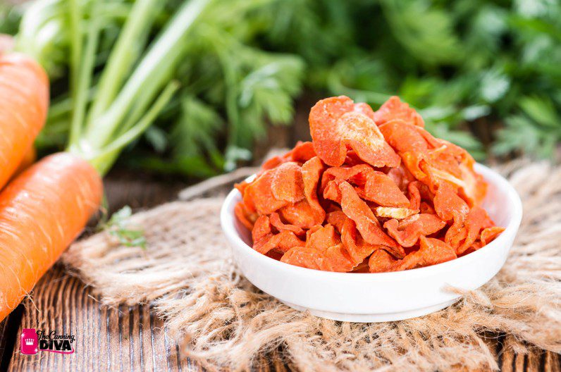 Dehydrated Carrots with fresh carrots on the side with logo the canning diva